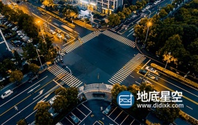 视频素材-城市交通十字路口车流大气日转夜延时航拍